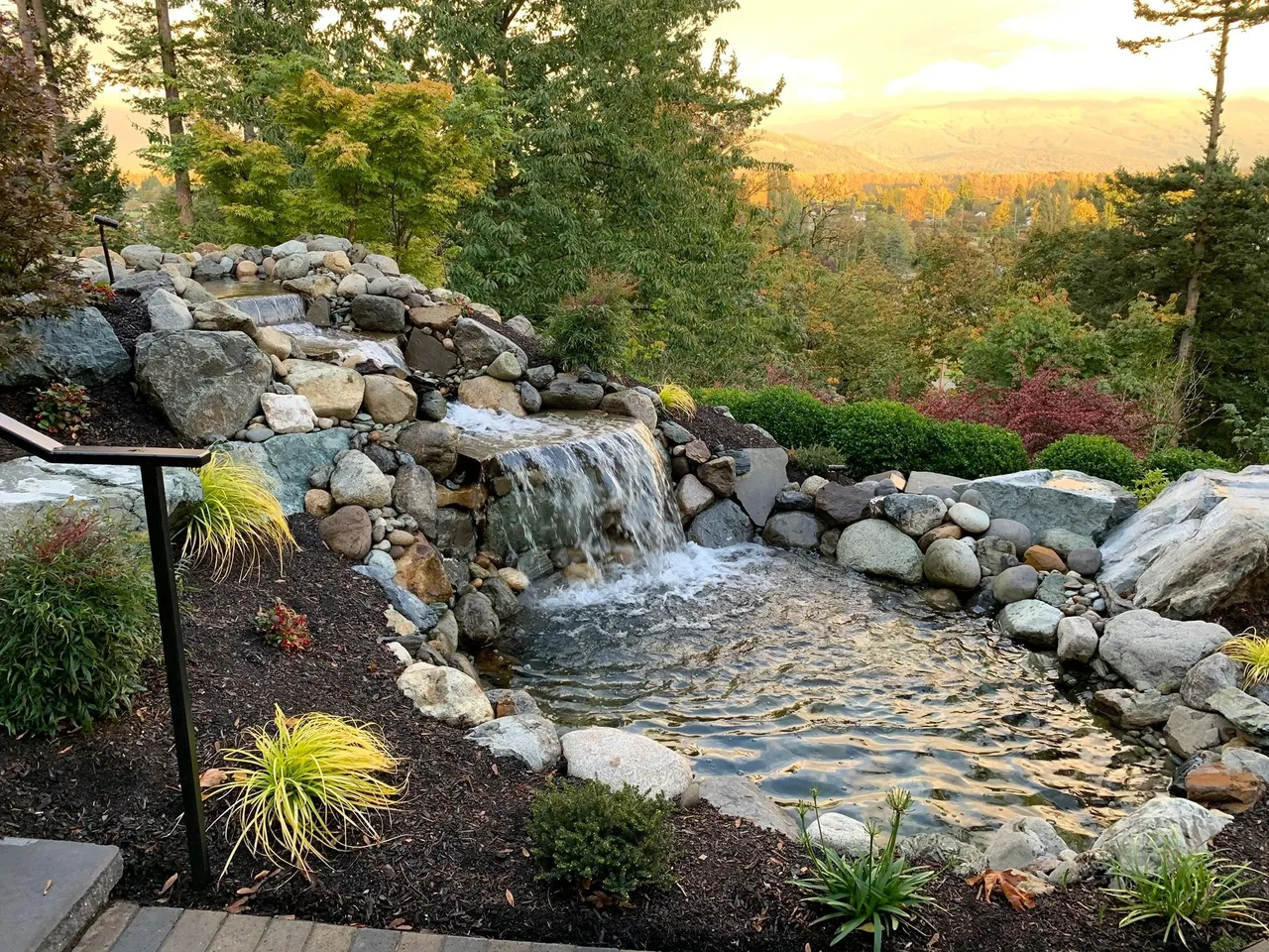 Tiered waterfall pond at sunset